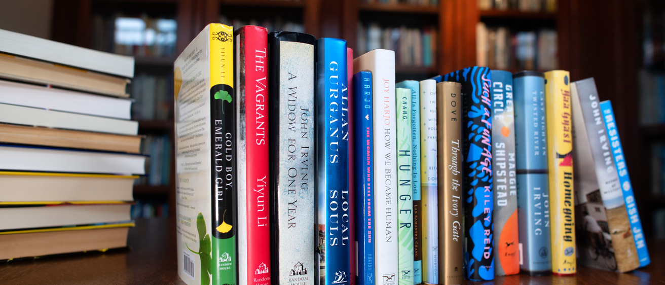 Row of books lined up on a table