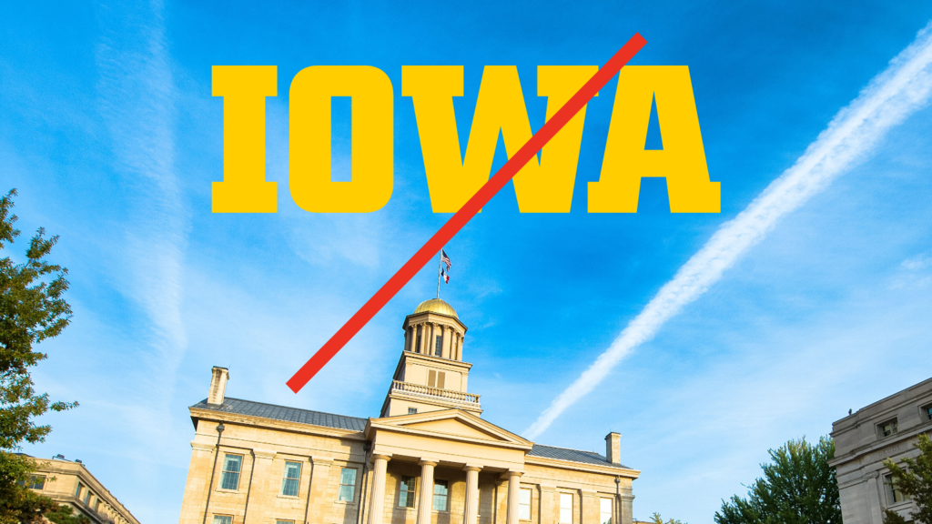 Prohibited example showing block IOWA logo over a blue sky in a photo