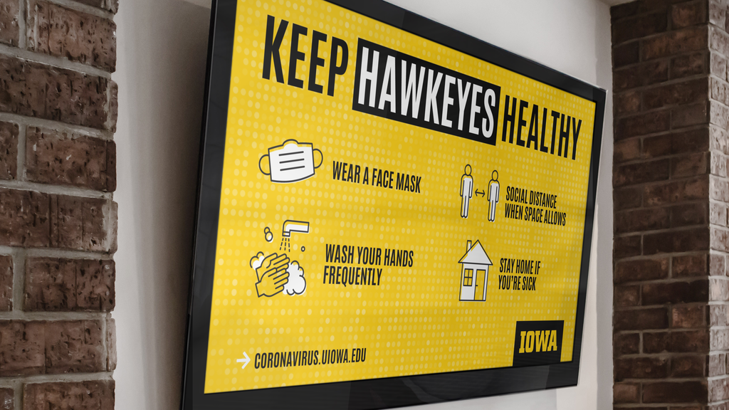 "Keep Hawkeyes Healthy" branded message shown on an LED screen